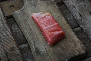 Fresh fish fillet on a wooden table