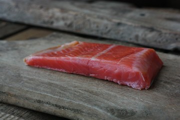 Fresh fish fillet on a wooden table
