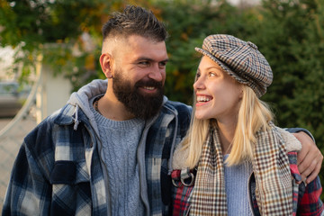 Fototapeta premium Couple in love. Happy young couple in love enjoying their romantic moment. Beautiful couple in love walking outdoors. Carefree time together. Fall autumn season.
