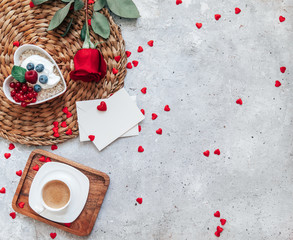 Fototapeta na wymiar Valentines day greeting card. Romantic Breakfast on Valentine's Day. oatmeal, coffee and rose. top view, flat lay