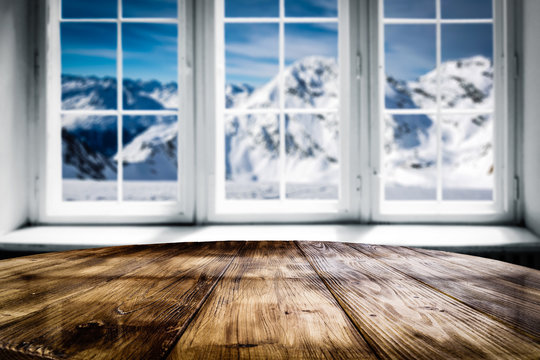 Desk of free space and winter window background 