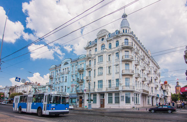 Plakat trolleybus in front old building on the street in Vinnytsya, Ukraine