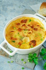 Homemade scalloped potatoes/ Potato gratin close up, selective focus
