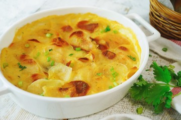 Homemade scalloped potatoes/ Potato gratin close up, selective focus
