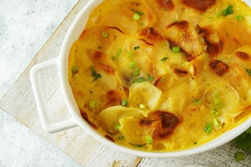 Homemade scalloped potatoes/ Potato gratin close up, selective focus