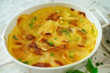 Homemade scalloped potatoes/ Potato gratin close up, selective focus