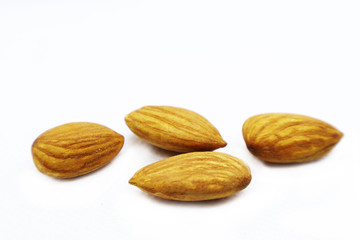 Almonds on white background. Almond set, Side View. Full depth of field.