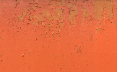 Old Rusty painted metal background. Red Peeling paint texture.