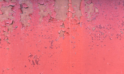 Old Rusty painted metal background. Red Peeling paint texture.