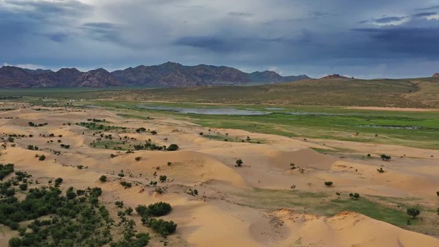 Aerial view of the sand dunes Elsen Tasarhai (Bayan Gobi) at sunset in Mongolia, 4k