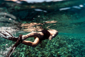 Snorkeling through the ocean of egypt, underwater snorkeling, male man snorkeling in the ocean