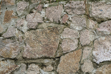 Part of the fence made of large artificial stones