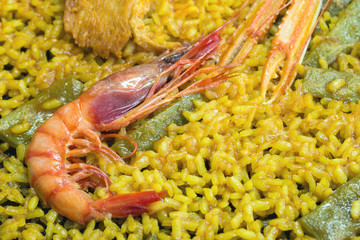 Traditional Valencian cuisine. The national Spanish dish of Valencia is Paella Valencia. Tasty lunch in a Spanish restaurant. Close-up.