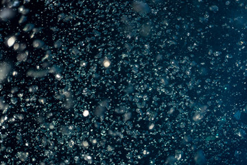 Abstract underwater scene sun ray and air bubbles in deep blue sea