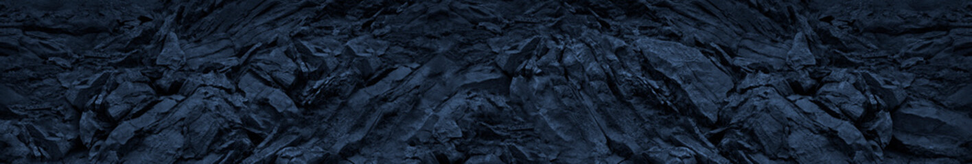 Blue toned mountain texture background. Abstract dark blue stone background.Grunge banner. Blue...