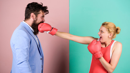 Couple in love competing in boxing. Conflict concept. Gender battle. Gender equal rights. Family...