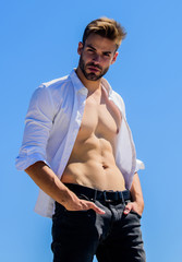 Attractive torso. Hot day outdoors. Attractive man taking off shirt. Confident in his appealing....