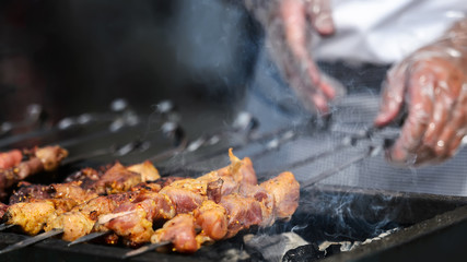 Pork skewers on the grill in the fresh air