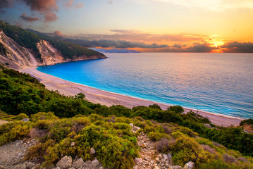 Beautiful summer sunset on Mirtos beach in Greece