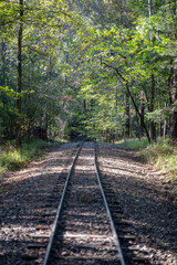 Fototapeta premium Railroads and roadways make there way through Broken Bow, Oklahoma.