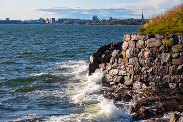 Helsinki. Finland. Baltic sea. The waves break on the rocky shore and the stone walls. The panorama...