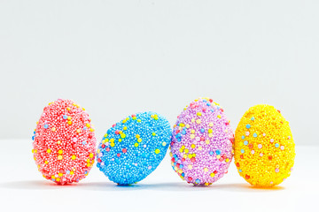 Fototapeta premium multi color eggs isolated on white