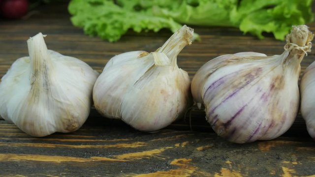 Fresh garlic on a wooden background