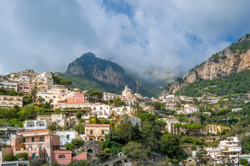 Fototapeta na wymiar Landscape of Positano village with mountain range on the background. Amalfi coast, Italy.