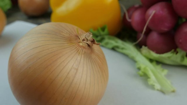 Fresh onions on a wooden background