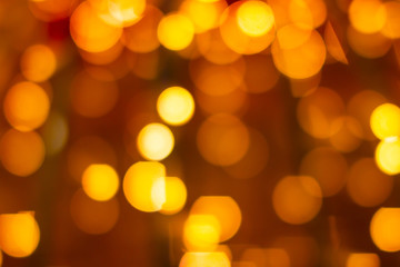 Orange bokeh defocused blurred lights. Abstract background