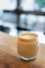 cup of coffee on wooden table