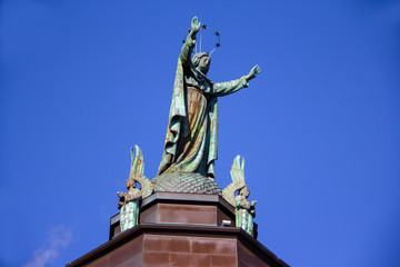 Fototapeta na wymiar Statue atop a historic Montreal church