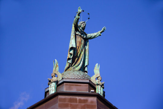 Statue atop a historic Montreal church