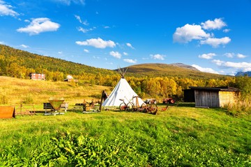 Bardu wooden architecture heritage park. Antique buildings, agricultural machines and tipi © Milosz Maslanka