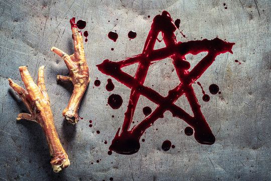Pentagram painted with blood on a metal table