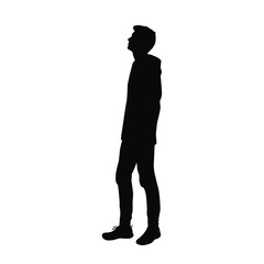 Vector silhouette of a man in a hoodie and jeans standing, profile, black color, isolated on a white background