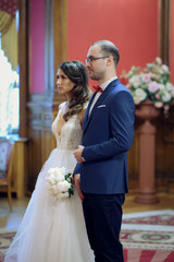  Classic wedding ceremony of a beautiful European couple in a palace.