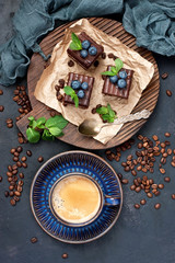Chocolate cakes with cup of hot black coffee
