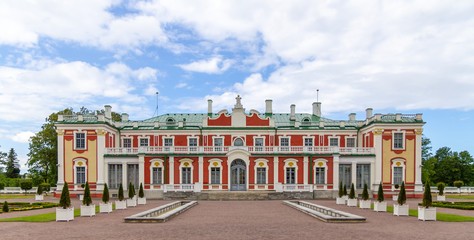 The red and yellow exterior facade of the Kadriorg palace in Tallinn, Estonia