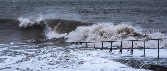 Storm Brendan hits Ireland. Photo taken in Blackrock Villag, Co Louth 13th January 2020..Dark sky, heavy rain and huge powerfull waves lash over the sea.