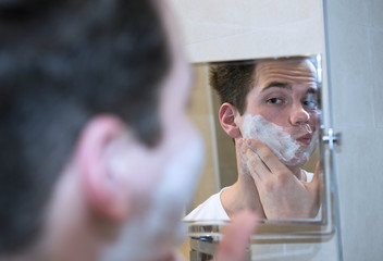 young man shaving