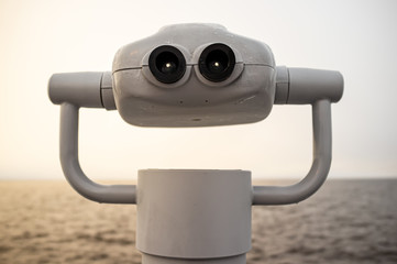 Tower viewer on the background of the sea and the horizon, in the early morning.