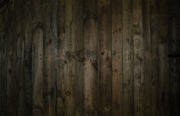 Dark brown reclaimed wooden rustic grunge planks background texture