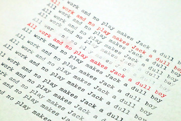 ALL WORK AND NO PLAY MAKES JACK A DULL BOY page of paper typed with an old vintage Typewriter