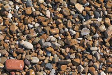 High-angle view of pebbles on the beach