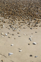 High-angle view of pebbles on the beach