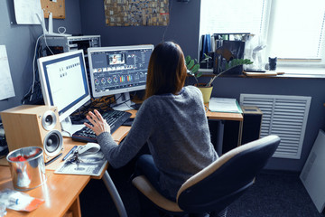 A Dark-haired Female Works In A Video Editor