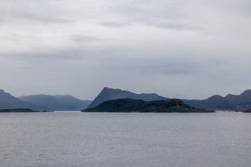 Cold grey color Norway landscape on fjord coast 