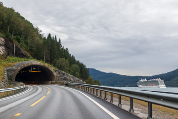 Mountains cloudy road to tunnel travel Norway 