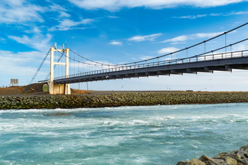 Beautiful cold winter landscape of Jokulsarlon glacier lagoon, Iceland, in the winter with the bridge as a background
